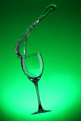Water splashes out of water glass