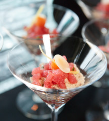 Small tuna snack in cocktail glass