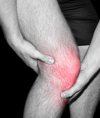 man suffering from joint pain in knee