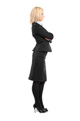 Full length portrait of a businesswoman waiting in line