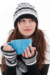 Girl is dreaming and holding a blue cup - obrazy, fototapety, plakaty