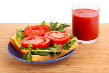 Sandwich with tomato juice isolated on white