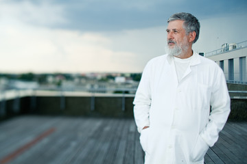 renowned scientist/doctor standing on the roof