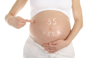 stomachs of pregnant women with the inscription