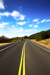 High speed road pass through the jugle with cloud background