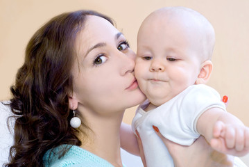 Portrait of young mum together with a small son