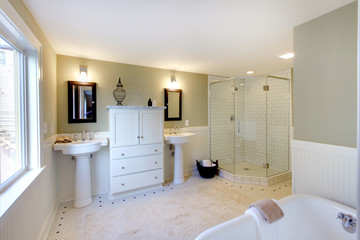 Luxury bathroom with iron tub and glass shower.