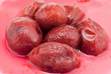 pickled plums with red  juice bakcground