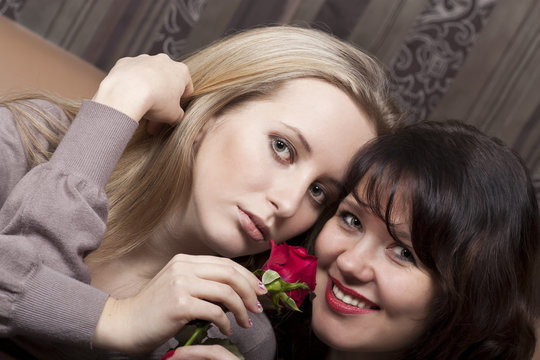 Pretty girls with a red rose