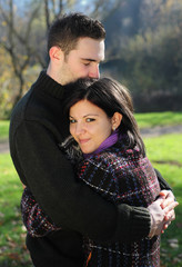 Portrait of romantic young couple in autumn outdoor