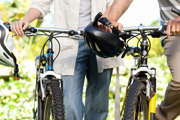Joyful couple with their bikes