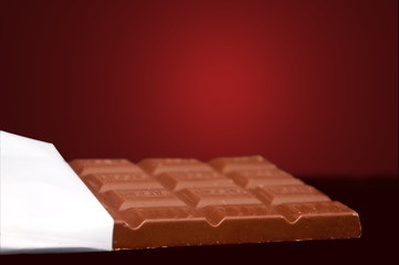 chocolate in bar with open white cover