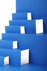 abstract blue paper composition with stairs and cutout squares