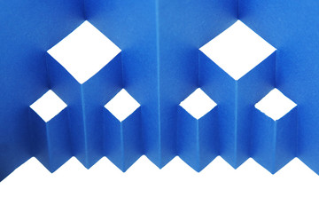 abstract blue paper composition with cutout rhombus and zigzag