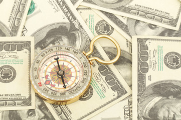Dollars and compass.