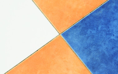 Orange, blue and white paving stone pattern, background