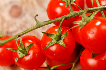 Cherry tomatoes on the wood background