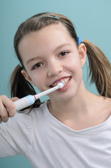 girl cleaning teeth with toothbrush