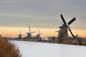 windmills in Kinderdijk at winter sunset