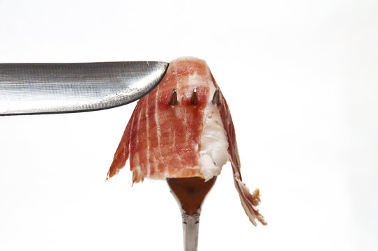 jamon iberico pinchado con tenedor