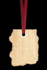 cardboard blank tag isolated on black background