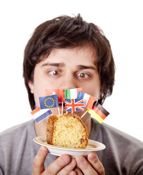 Men keep cake with european flags.