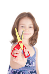 Smiling girl holding scissors