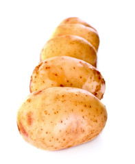 Few potatoes isolated on white