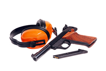 target pistol and hearing protectors