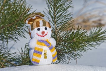 happy snowman on a fir tree background