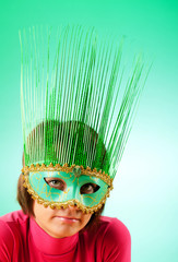 Attractive woman posing in the stylish mask