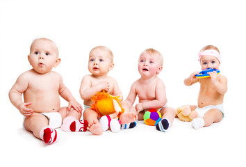 Four babies playing