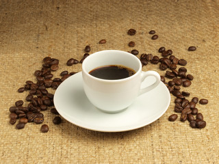 Cup of cofee and coffee beans.
