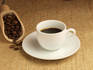 Cup of coffee and coffee beans.