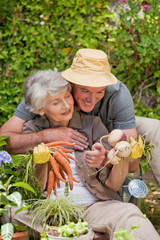 Man hugging his woman in the garden