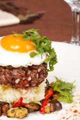 beef burger with egg and potatoes
