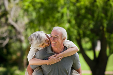 Man giving wife a piggyback