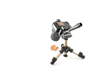 Modern digital camera on a table tripod