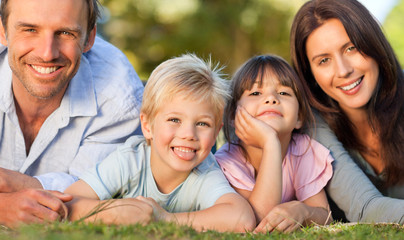 Family lying down in the park