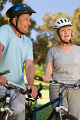 Naklejka premium Elderly couple with their bikes