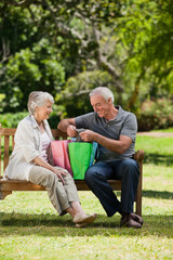 Retired couple with shopping bags