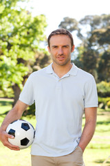 Naklejka premium Handsome man with a ball