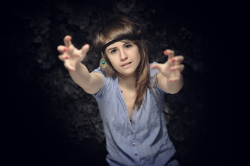 Young, beautiful woman posing in studio