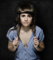 Young, beautiful woman posing in studio