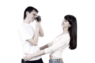 Young beauty couple with photo camera isolated on white backgrou