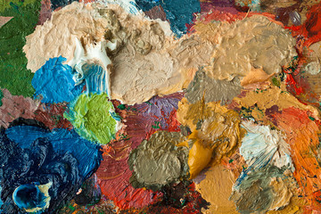 closeup of artists palette with mixed oil paint.