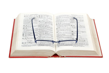 Dictionary and glasses