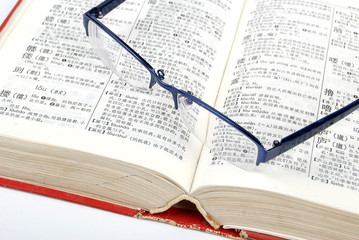 Dictionary and glasses