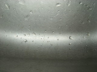 Water drops on an iron surface.