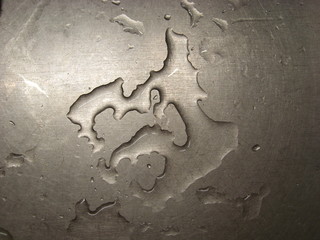 Water on a metal surface.